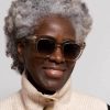 woman wearing pale oversize sunglasses
