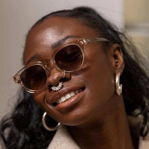 woman wearing sustainable transparent round sunglasses made from bioacetate