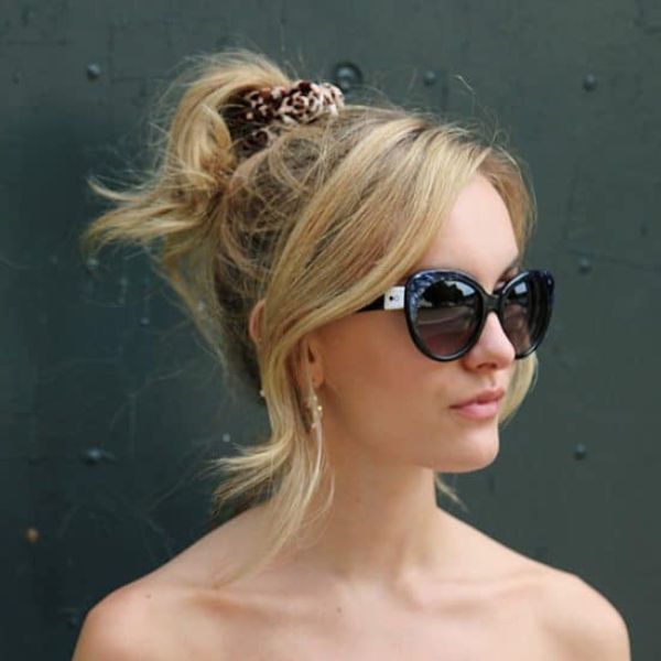 Woman wearing cateye oversized ethical sunglasses in black