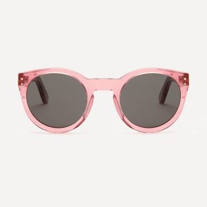 Pala's bestselling round frame Baobab. Displayed in transparent coral pink bio-acetate with grey eco lenses. Great for small faces and retro styling.